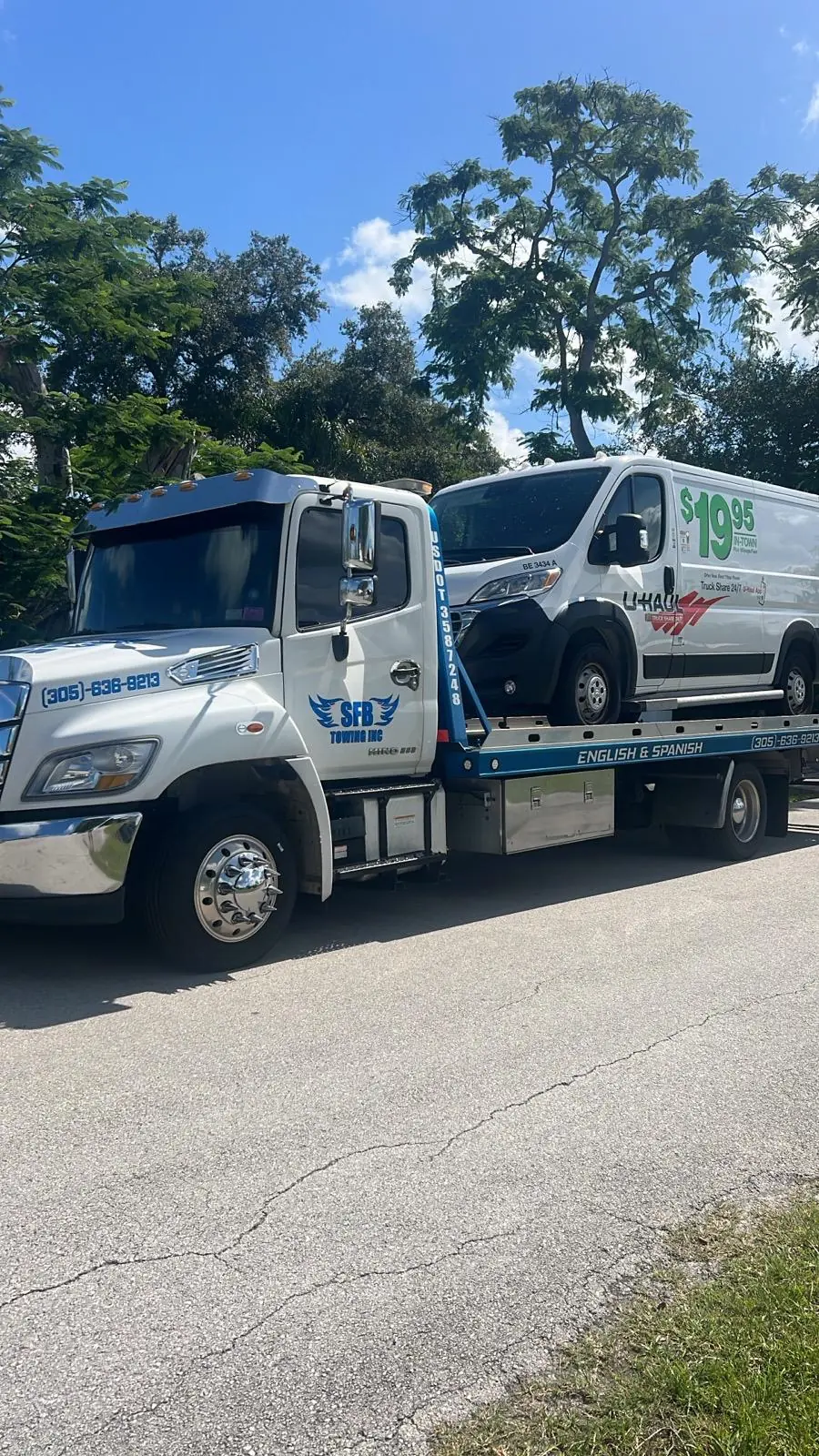 SFB Towing flatbed with a U-Haul box van on the bed